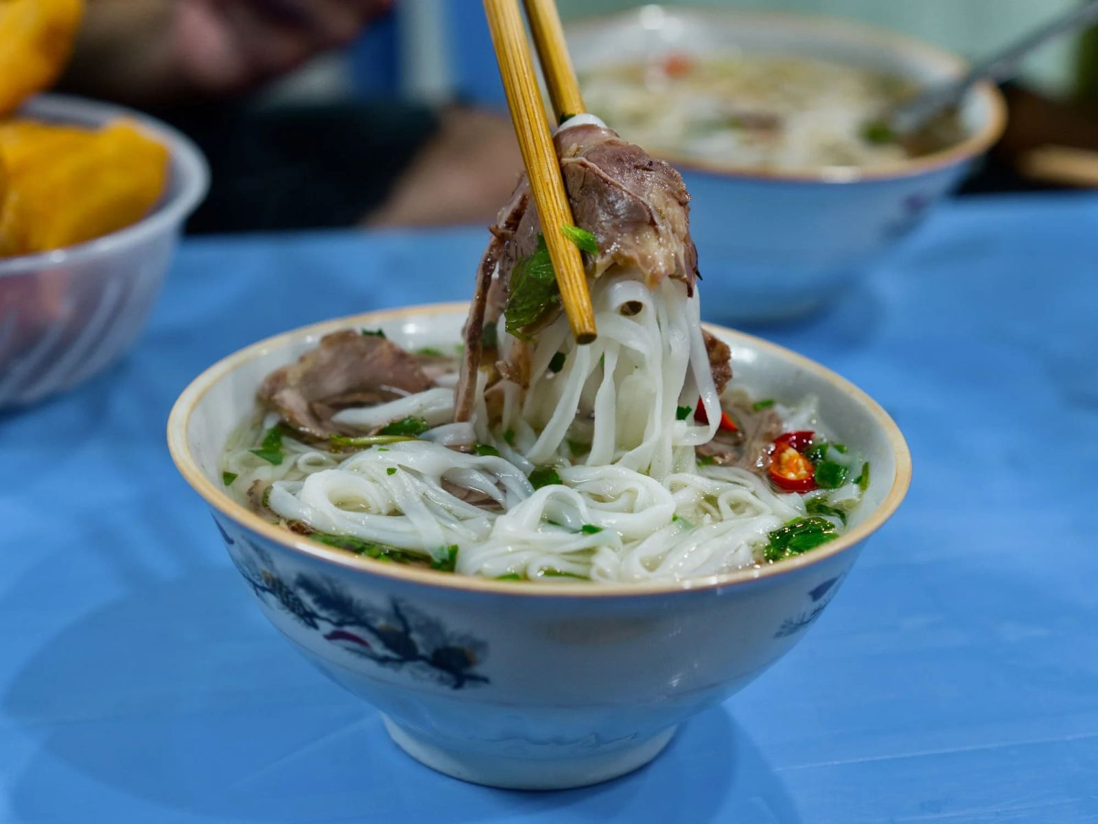 Try Iconic Dishes: Pho, Bun Cha, Egg Coffee