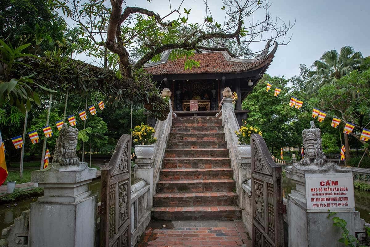 Historic One Pillar Pagoda decorated with Buddhist flags in Hanoi