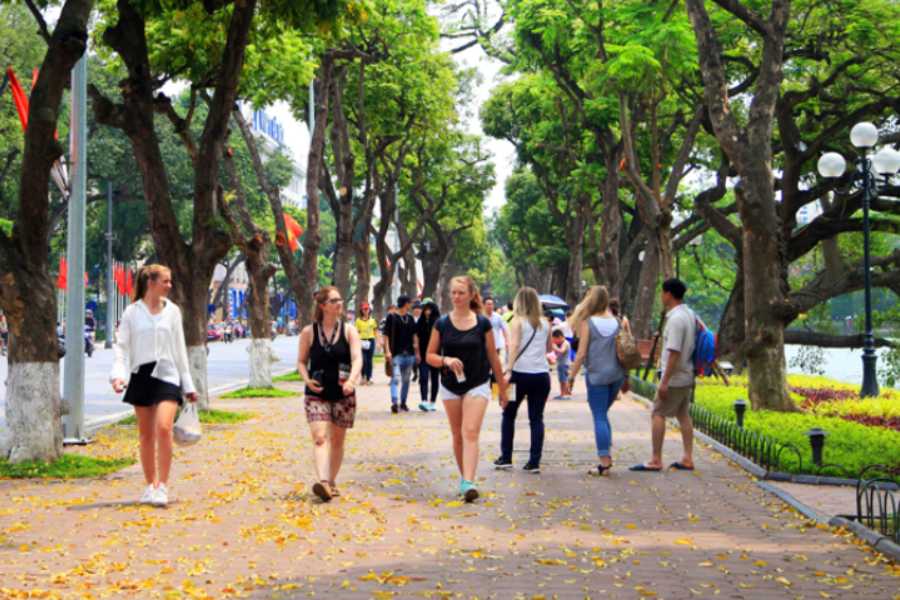 people enjoying autumn season in hanoi